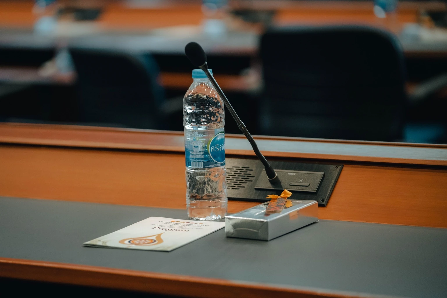 Meeting table with a microphone and a water bottle